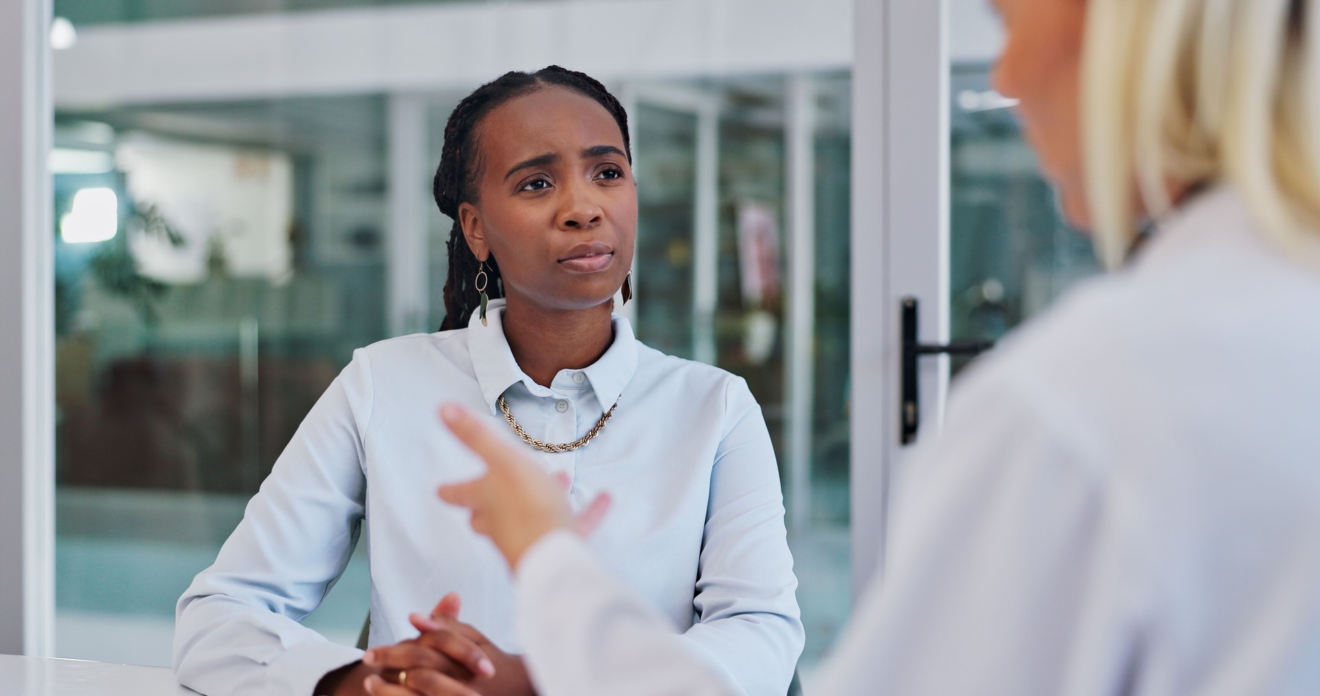 Meeting, discussion and black woman in office with manager for planning, project and consulting. Corporate, teamwork and workers in conversation, talking and public relations ideas for collaboration